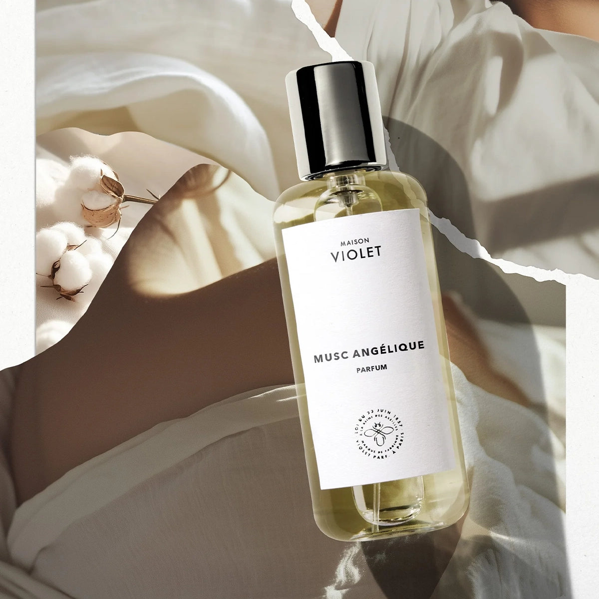 Musc Angélique by Maison Violet luxury perfume bottle placed on fabric with natural shadows