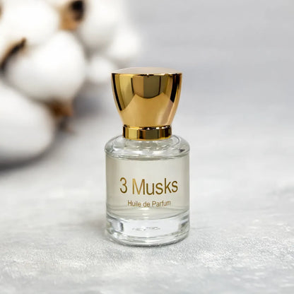 3 Musks fragrance bottle on soft fabric surface with subtle blurred background
