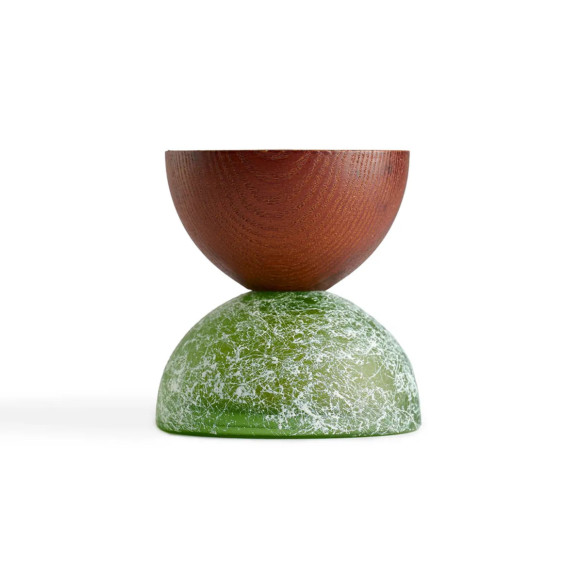 Wooden and green stone-like object on a white background