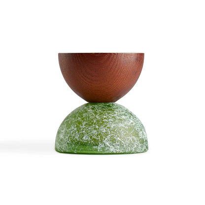 Wooden and green stone-like object on a white background