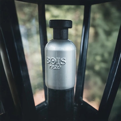 BOIS 1920 perfume bottle on a blurred natural background