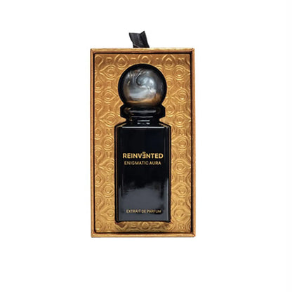 Perfume bottle in a decorative gold box with 'Reinvented' branding on a white background