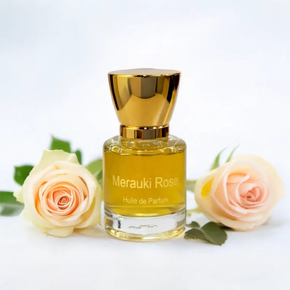 Merauki Rose fragrance bottle placed between blooming roses on a bright minimal background