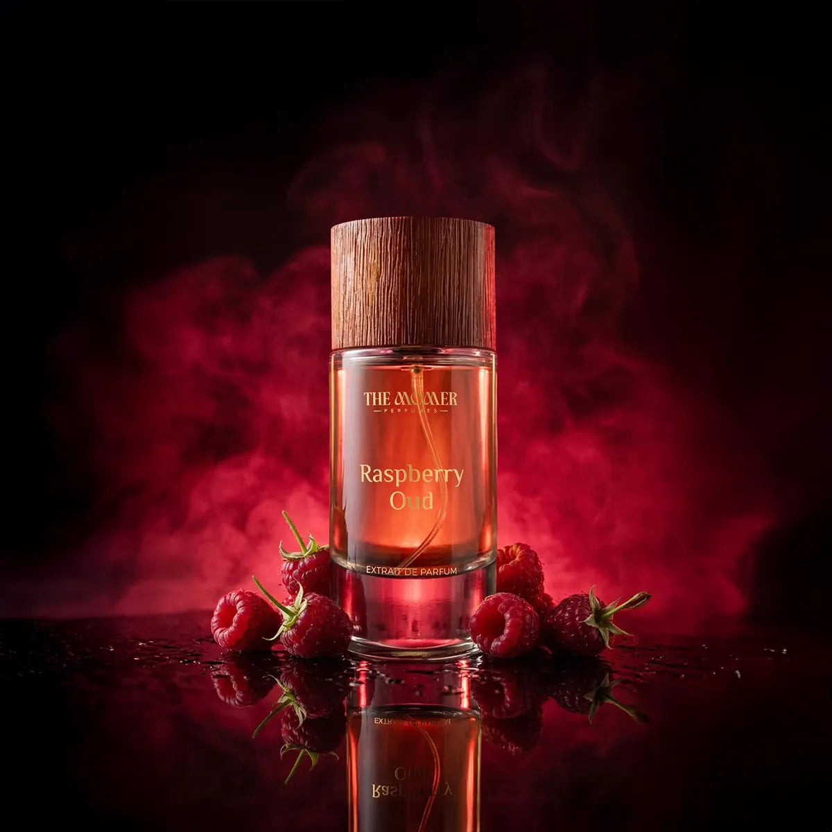 Perfume bottle labeled 'Raspberry Oud' with raspberries on a dark background