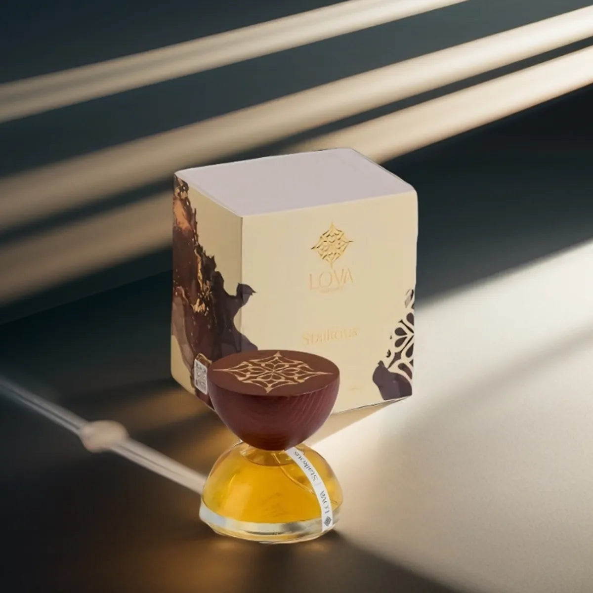 Aroma diffuser with a decorative box on a dark surface